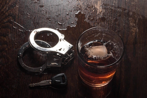 Whiskey Glass and Handcuffs - Probation Terms for DUI Offenders