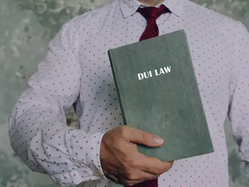 dui lawyer holding book about dui law