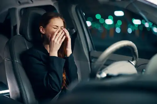 Woman crying in car