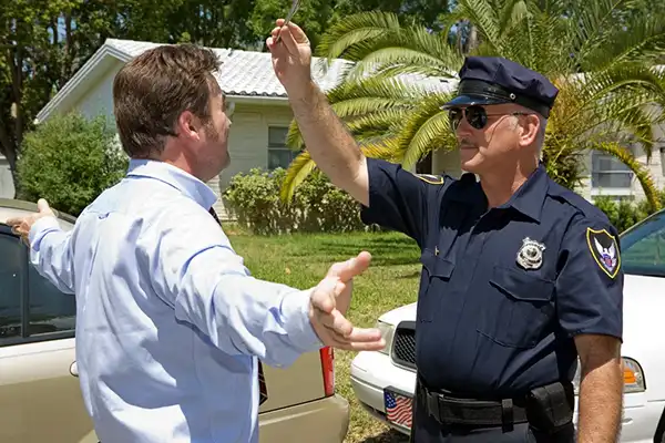 police officer pulls over a man for drunk driving and administers blood alcohol content field tests